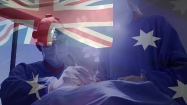 Avustralya bayrağının ameliyat sırasında beyaz cerrahlar üzerinde canlanması. Tıp, vatanseverlik ve dijital arayüz kavramı, dijital olarak üretilen video.