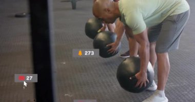 Spor salonunda egzersiz yapan farklı insanlar üzerinde medya simgelerinin canlandırılması. Teknoloji, spor ve dijital arayüz kavramı, dijital olarak üretilen video.