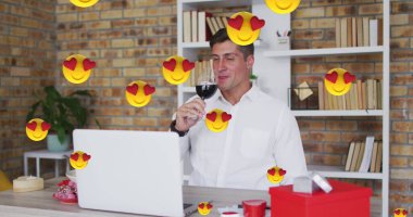 Image of emojis with red hearts flying over caucasian man drinking red wine on laptop image call. valentine's day, love and romance concept digitally generated image. clipart