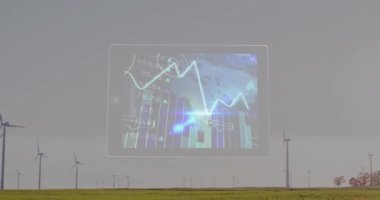 Alandaki rüzgar türbinlerinin üzerindeki veri animasyonuyla tablet arayüzü. Yenilenebilir enerji, teknoloji, rüzgar gücü, sürdürülebilirlik, dijital