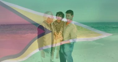 Guyana bayrak animasyonunda aile bağı. Beraberlik, tatil, tatil, açık hava, kum, okyanus