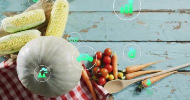 Ahşap masada taze sebzeler ve çevre dostu ikonlar. Organik, sağlıklı, beslenme, gıda, sürdürülebilirlik, yeşil konsept