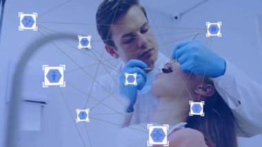 Diş hekimi, hastayı diş aletleriyle tedavi ediyor, olay yerinde ağ animasyonu yapıyor. Diş sağlığı, sağlık, tedavi, teknoloji, yenilik, dijital