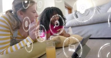 Tablet izlerken, üzerinde dijital teknoloji simgeleri olan iki kadın. communication, Connectivity, innovation, social media, Internet, digital device concept