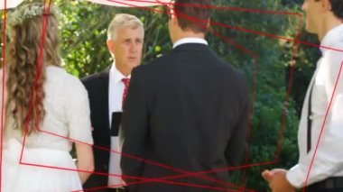 Gelin, damat ve kırmızı ağ bağlantılarıyla düğün töreninde görevli. romantizm, kutlama, birlik, aşk, dijital, teknoloji