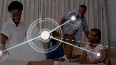 Aile kutuları açmak ve birlikte gülmek üzerine bir bağlantı ağı. hareket, kahkaha, bağlanma, birliktelik