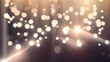 Parlayan ışık parçacıkları ve ışınlar koyu arkaplan üzerinde canlandırma. 