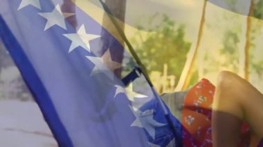 Amerikan bayrak animasyonu parktaki açık hava aktivitelerinin keyfini çıkaran insanları kapsıyor. Vatanseverlik, açık hava, eğlence, özgürlük, kutlama, aile