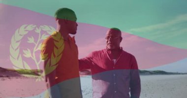 Eritre bayrağı animasyonu. Sahilde konuşan iki adamın sohbetin keyfini çıkarması. Seyahat, arkadaşlık, kültür, kıyı şeridi, açık hava, deniz kenarı