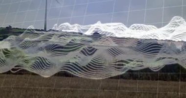 Rüzgâr türbini, arka planda veri dalgası animasyonuyla kırsal alanda dönüyor. Sürdürülebilirlik, yenilenebilirlik, enerji, teknoloji, güç, yenilik