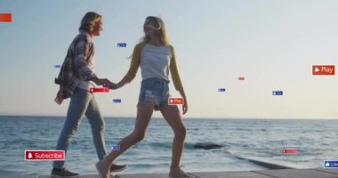 Sosyal medya, çiftlerin el ele tutuşup deniz kenarında yürümelerini konu alan bir animasyon. Romantizm, sahil, günbatımı, teknoloji, aşk, bağlantı