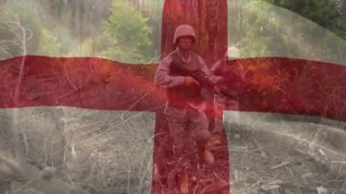 İngiliz bayrağının, tüfekli beyaz erkek askerler üzerinde canlandırılması. Askeri, vatanseverlik ve bayraklar dijital olarak üretilen video konsepti.