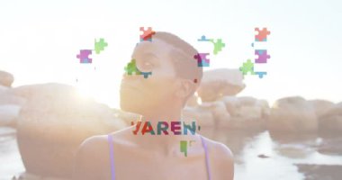 UMUT Otizm Farkındalığı Ayı animasyonu kayalık kıyı şeridinin yanında duran kişi için. maluliyet, destek, kapsayıcılık, zihinsel sağlık, eğitim, çeşitlilik