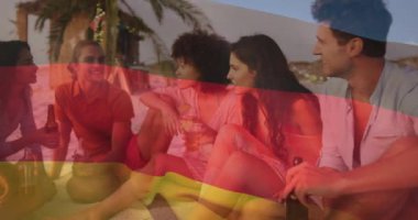 Alman bayrak animasyonu sahildeki dostların üzerinde, içki ve sohbetin tadını çıkarıyor. Eğlence, rahatlama, açık hava, yaz, dalgalı bayrak