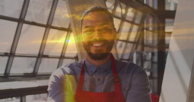 Image of landscape over biracial male barista. Global business, finances and digital interface concept digitally generated image. clipart