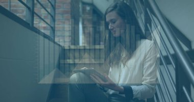 Image of graphs over thoughtful caucasian woman sitting on staircase using digital tablet. Digital composite, multiple exposure, report, business, abstract and technology concept. clipart