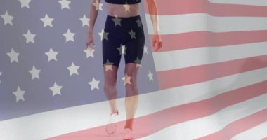 Amerika bayrağının Afro-Amerikan bayan sporcu üzerinden canlandırılması. Küresel spor, spor disiplinleri ve bayraklar dijital olarak oluşturulmuş video konsepti.