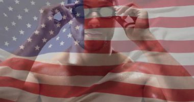 Amerikan bayrağının, çift ırklı erkek yüzücü üzerinden canlandırılması. Küresel spor, spor disiplinleri ve bayraklar dijital olarak oluşturulmuş video konsepti.