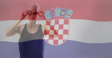 Beyaz kadın yüzücü üzerine Hırvat bayrağı animasyonu. Küresel spor, spor disiplinleri ve bayraklar dijital olarak oluşturulmuş video konsepti.