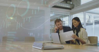 Global business colleagues discussing over document in conference room at office. Financial graphs and data image over cityscape.  clipart