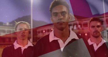 İngiliz bayrağının animasyonu sahada çeşitli erkek ragbi oyuncuları üzerinde. Spor, vatanseverlik ve dijital arayüz konsepti dijital olarak oluşturulmuş video.