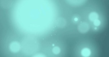 Mavi arkaplanda hareket eden parlak ışık lekelerinin canlandırması. Işık, renk ve hareket konsepti dijital olarak oluşturulmuş video.