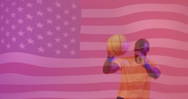 Image of flag of america over african american male basketball player jumping with ball. Sport, competition, flag, identitity, nationality and patriotism digitally generated image. clipart