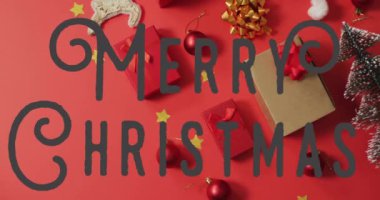 Kırmızı arka planda mutlu noel mesajları ve sunumların animasyonu. Noel, kutlama ve dijital arayüz kavramı dijital olarak oluşturulmuş video.