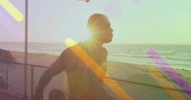 Sahilde gerinen Afro-Amerikan bir adamın hareketli görüntüsü. sağlık ve zindelik kavramı, dijital olarak üretilen görüntü.