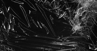 Siyah plastik dokunun hareketli görüntüsü. Soyut arkaplan, şablon ve doku kavramı dijital olarak oluşturuldu.