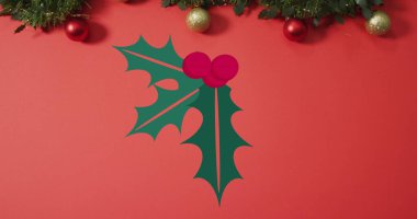 Image of christmas holly leaves and berries over christmas decorations. Christmas, festivity, celebration and tradition concept digitally generated image. clipart