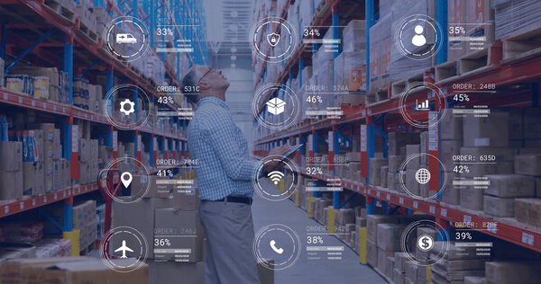 Image of icons and data processing over caucasian man working in warehouse. Global shipping, finance, business, connections, computing and data processing concept digitally generated image.