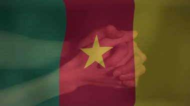 Kamerun bayrağının animasyonu birlik içinde el ele sarılmıştır. Ortaklık, takım çalışması, işbirliği, çeşitlilik, uyum, dayanışma