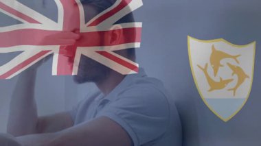 Düşünceli bir adamın okulda oturduğu Union Jack ve Anguilla bayrağının animasyonu. Bayraklar, düşünme, eğitim, tefekkür, çeşitlilik, çok kültürlü