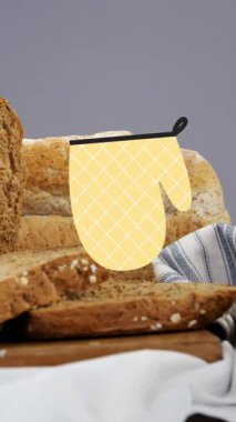 Ekmek üzerine düşen sarı eldivenlerin animasyonu. Beslenme ve hidrasyon haftası konsepti dijital olarak oluşturulmuş video.