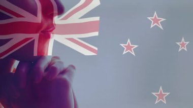 Yeni Zelanda bayrağı arkasında olan düşünceli kişinin Union Jack animasyonu. Vatanseverlik, ulusal, sembolik, soyut, kavramsal, illüstrasyon