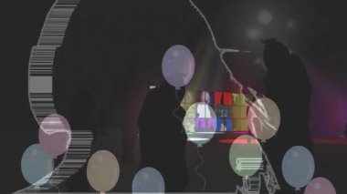 Parti animasyonunda renkli balonlarla dans eden siluetler ve canlı ışıklar. Dans, kutlama, canlandırma, şenlik