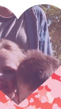 Animation of hearts and heart frame over happy caucasian mother and daughter in park. family, and spending time together concept digitally generated video.