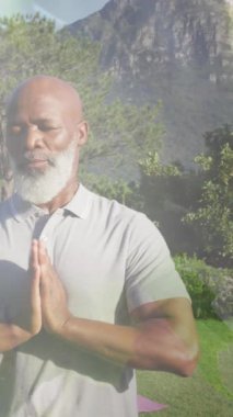 Yaşlı Afro-Amerikan bir adamın yoga ve meditasyon yapması üzerine yaprak animasyonu. dünya meditasyon günü ve dijital olarak üretilen video konsepti.
