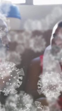 Değişik erkek futbol oyuncularının soyunma odasında uçuşan virüs hücrelerinin animasyonu. covid 19 pandemik konsept sırasında dijital olarak üretilen video sporu.