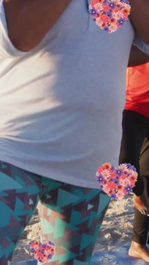 Sahilde yoga yapan yaşlı Afro-Amerikan çiftin kalp ikonlarının canlandırılması. moda ve yaşam tarzı konsepti dijital olarak oluşturulmuş video.