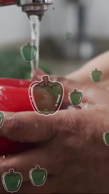 Beyaz adamın sebze yıkaması üzerine biber ikonlarının canlandırılması. Ulusal vejetaryen haftası ve dijital olarak oluşturulan kutlama konsepti.