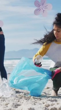 Çeşitli kadın ve erkek gönüllülerin sahildeki çöpleri toplaması üzerine çiçeklerin animasyonu. Çevre koruma gönüllüleri, plaj temizleme konsepti dijital olarak oluşturulmuş video.
