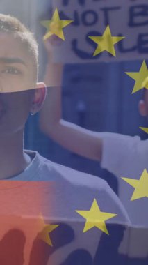 Melez erkek protestocu üzerine Rusya ve Avrupa Birliği bayrağının animasyonu. Ukrayna krizi ve uluslararası politika kavramı dijital olarak oluşturuldu.