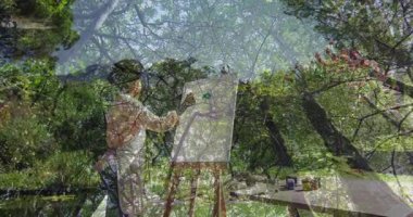 Tuvale resim yapmak, sanatçı yeşil orman manzaralı animasyon yaratmak. Sanatçılık, yaratıcılık, doğa, manzara, çevre, fırça çalışması