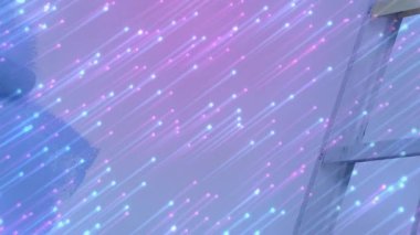 Renkli animasyonlara uzanan kişi dijital ışık çizgileriyle etkileşime giriyor. Teknoloji, yenilik, etkileşim, sanal, yaratıcılık