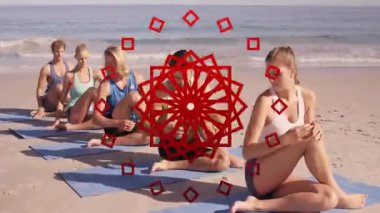Plaj minderlerinde yoga yapmak, grup halinde okyanus manzarasının tadını çıkarmak. Meditasyon, sağlık, rahatlama, fitness, maneviyat, sükunet