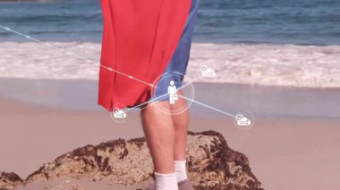 Sahildeki kırmızı pelerinli kişinin ağ bağlantısı simgeleriyle canlandırılması. Kahraman, teknoloji, iletişim, güçlendirme, dijital, bağlantı