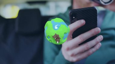 Rüzgâr türbinleri ve akıllı telefon kullanıcısının üstündeki uçakla renkli dünyanın animasyonu. Yenilenebilir, sürdürülebilirlik, teknoloji, yenilik, çevre, ekolojik