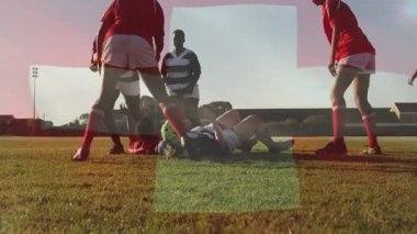 Sahada mücadele, rugby oyuncuları soyut şekillerin animasyonuyla sahneyi örtüyor. Spor, takım çalışması, rekabet, grafik, atletik, oyun